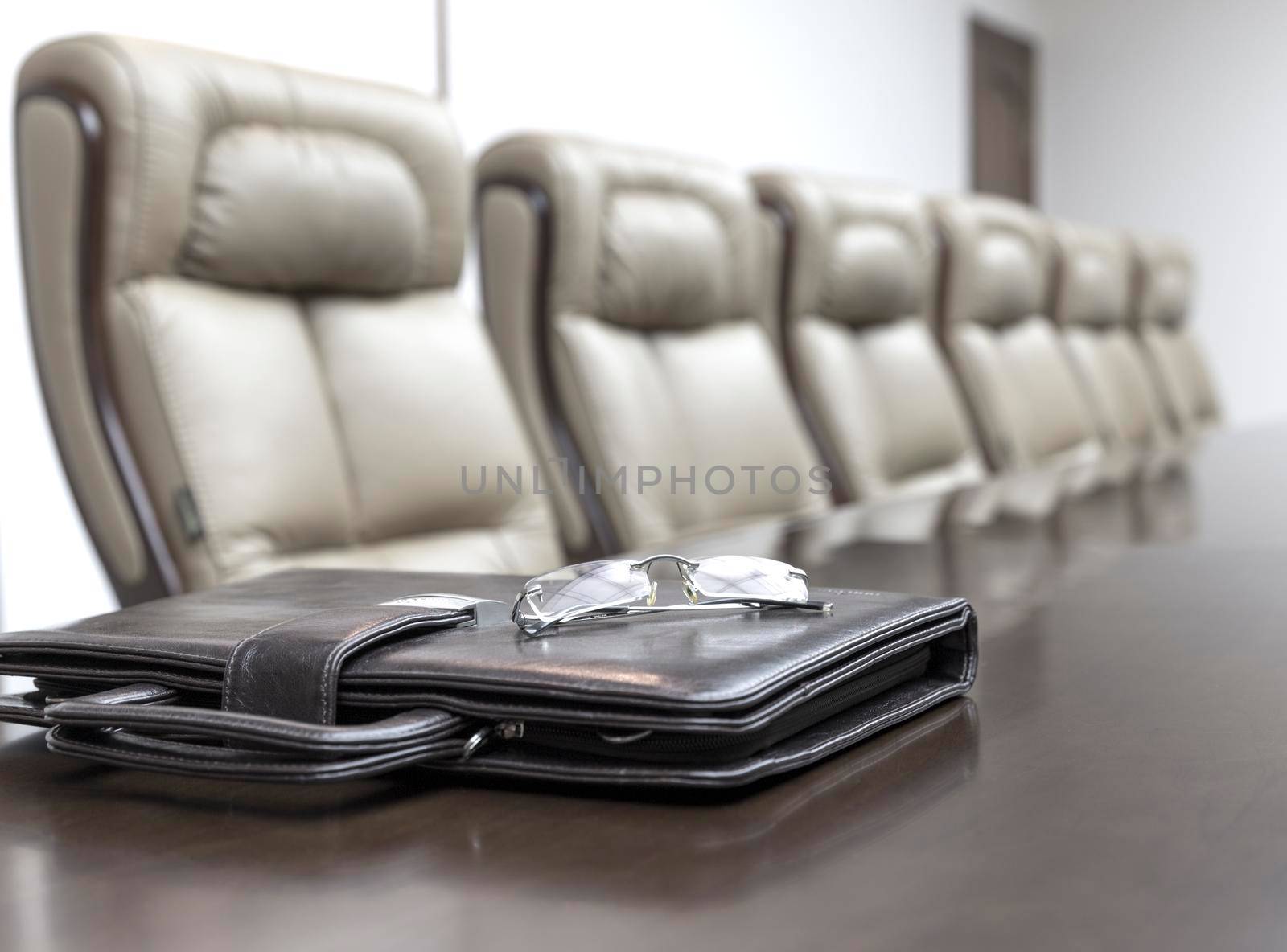 Closeup of on table in empty corporate conference room before business meeting in office