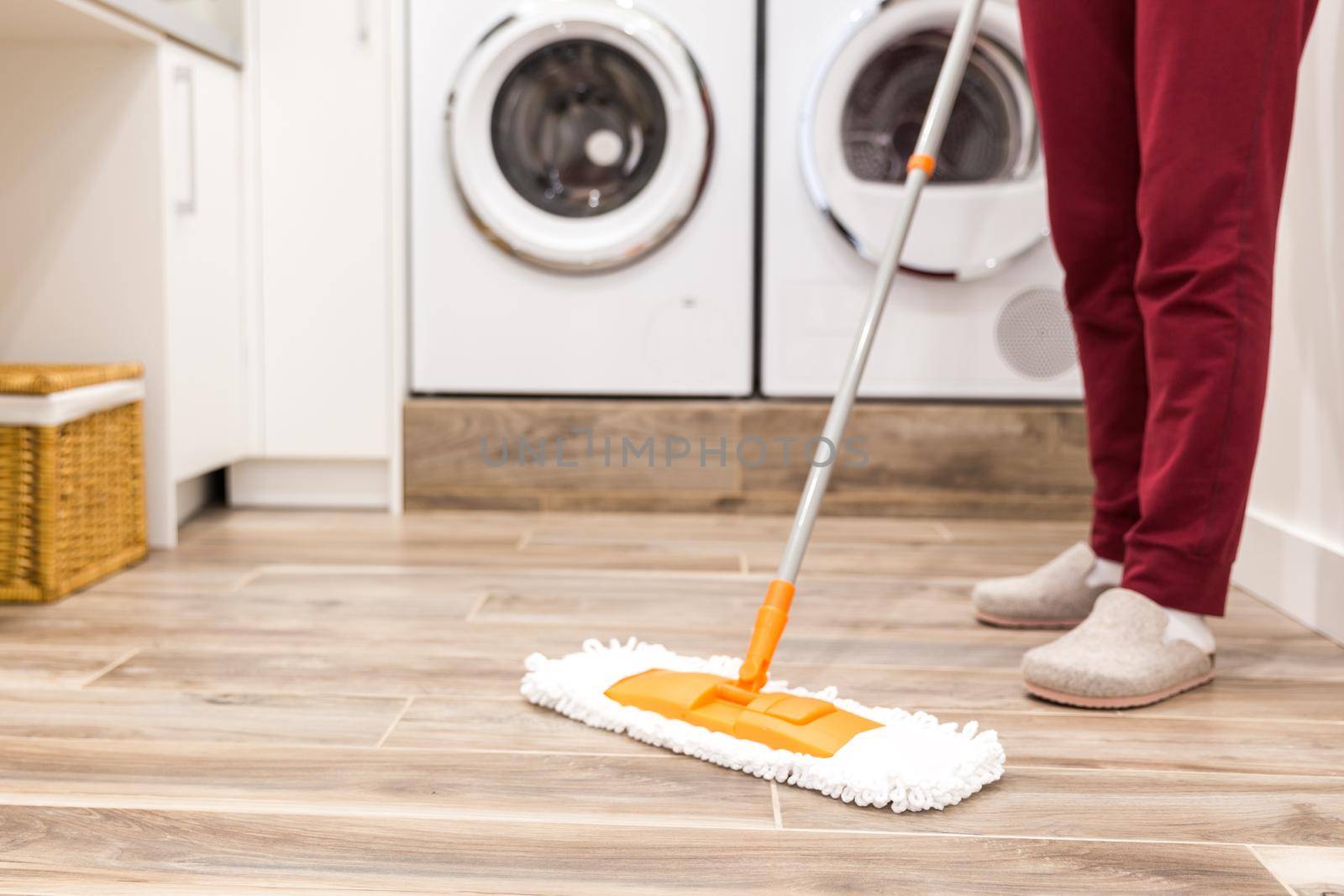 Cleaning floor in laundry room