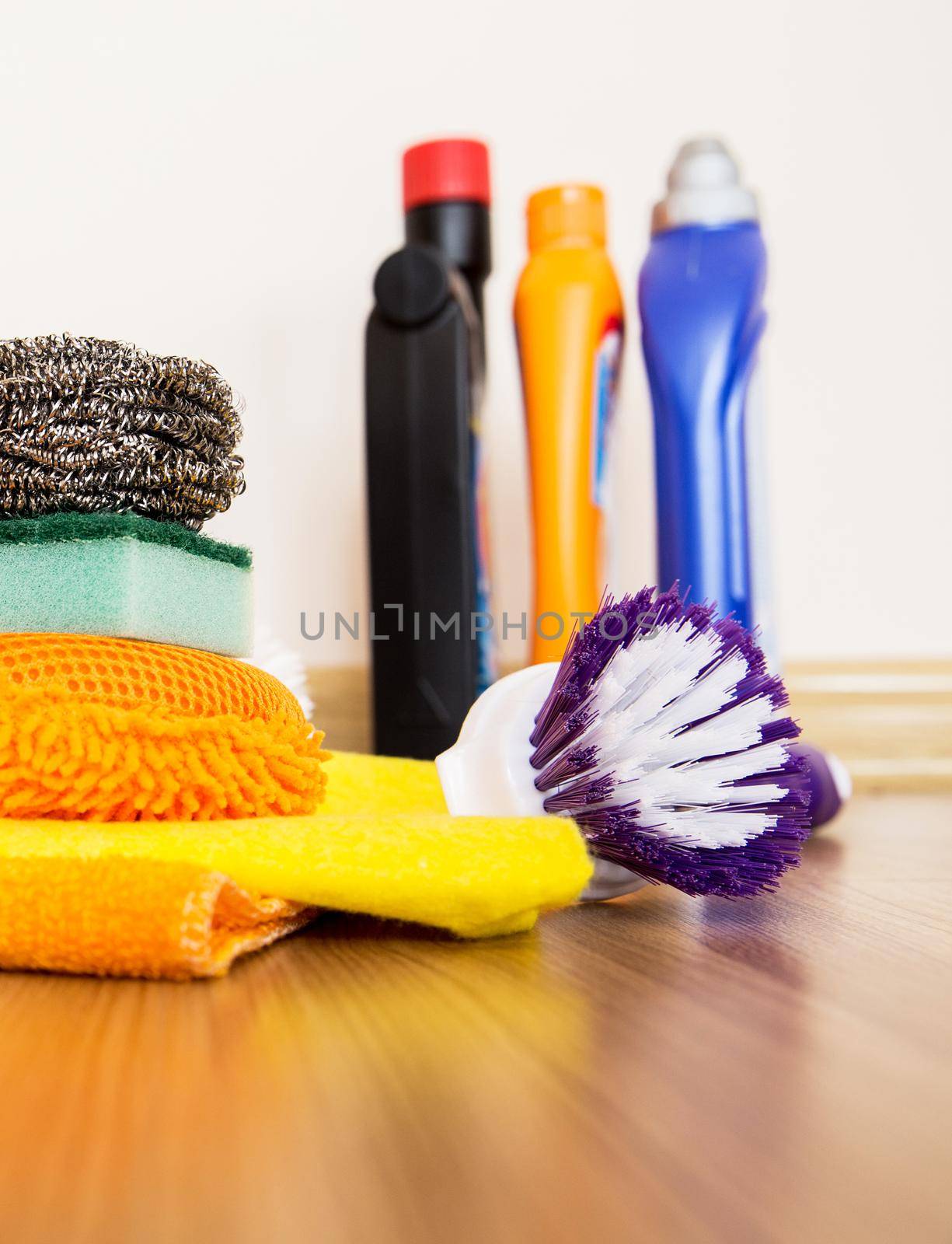 set of cleaning equipment on a wooden floor