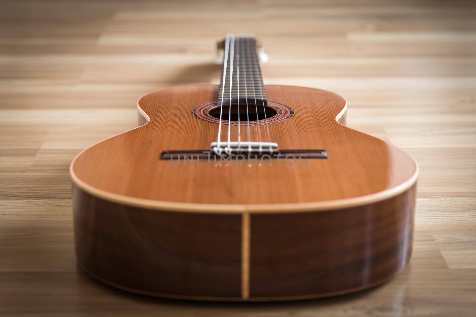 A classical guitar with six nylon strings