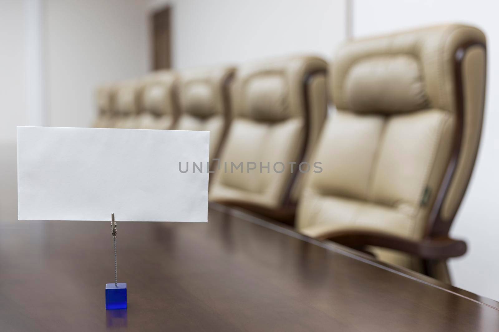 Closeup of on table in empty corporate conference room before business meeting in office