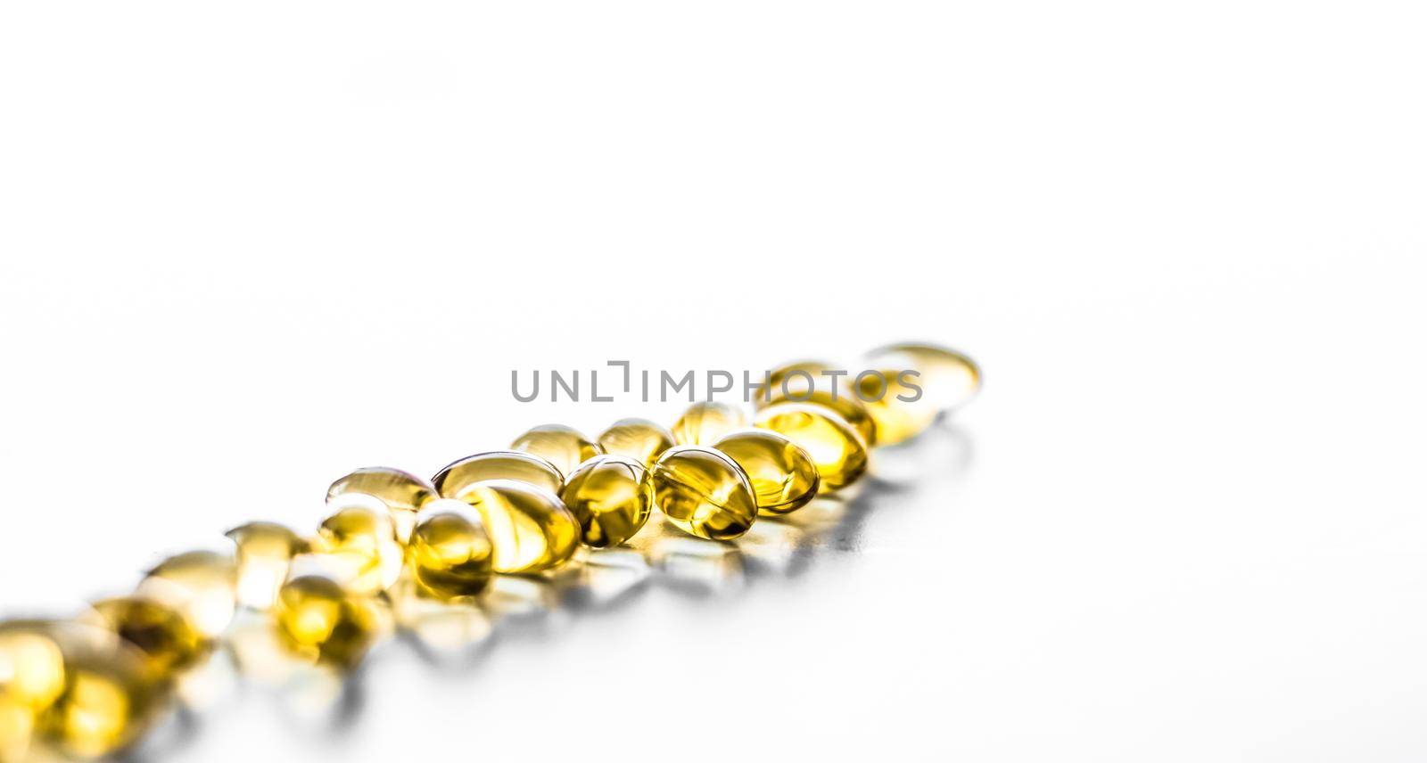 Pharmaceutical, branding and science concept - Vitamin D and golden Omega 3 pills for healthy diet nutrition, fish oil food supplement pill capsules, healthcare and medicine as pharmacy background