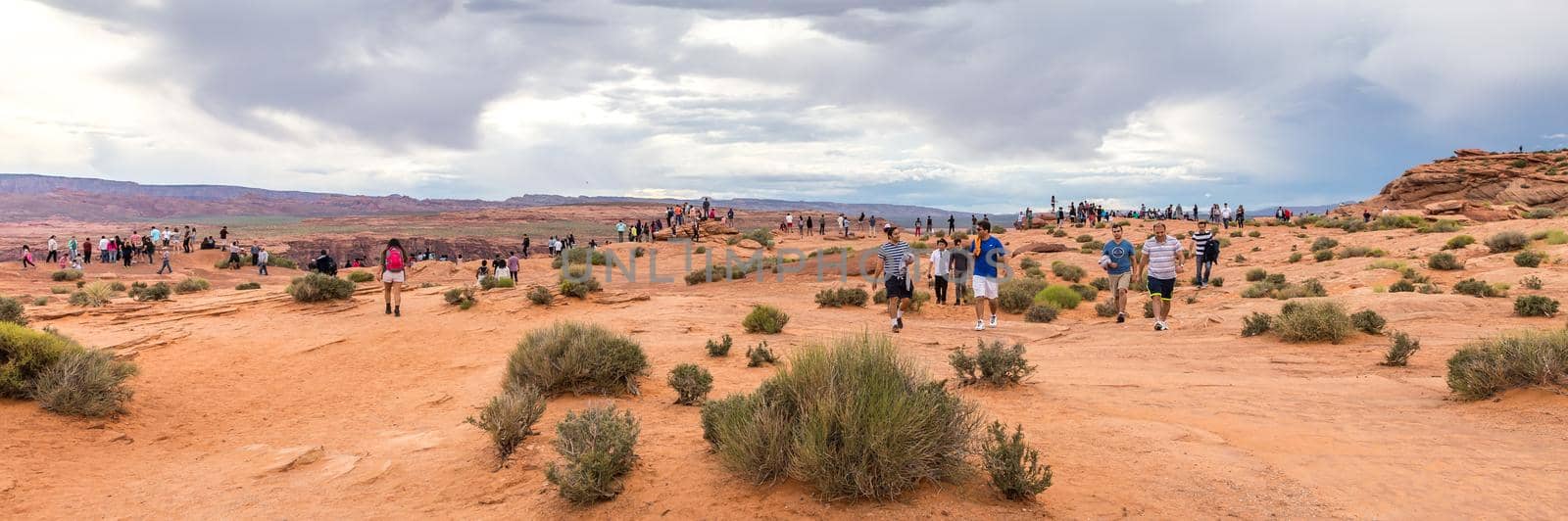 PAGE, ARIZONA - MAY 25: Hikers at Horseshoe Bend on May 25, 2015 in Page AZ,USA. Thousands of people from all over the world visit this unique place every year.