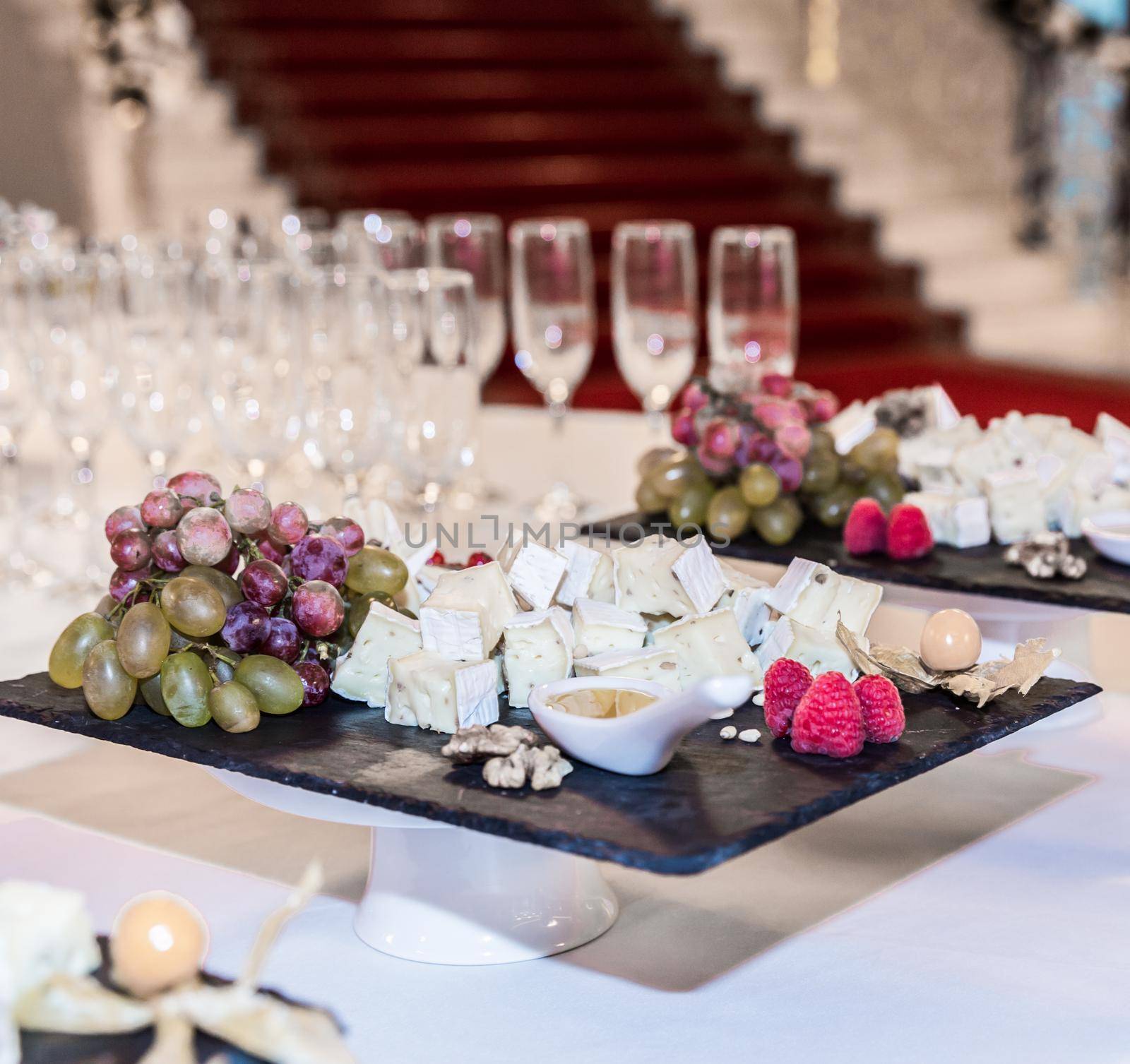 Buffet table with brie cheese and grapes