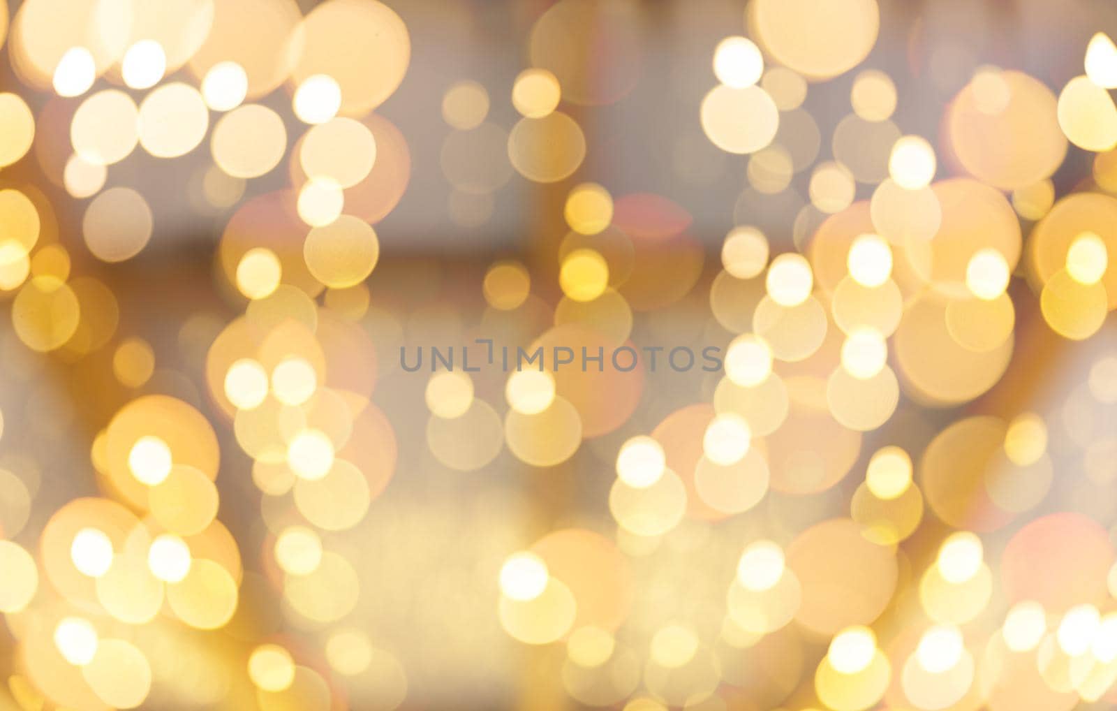 Golden abstract background with bokeh defocused lights
