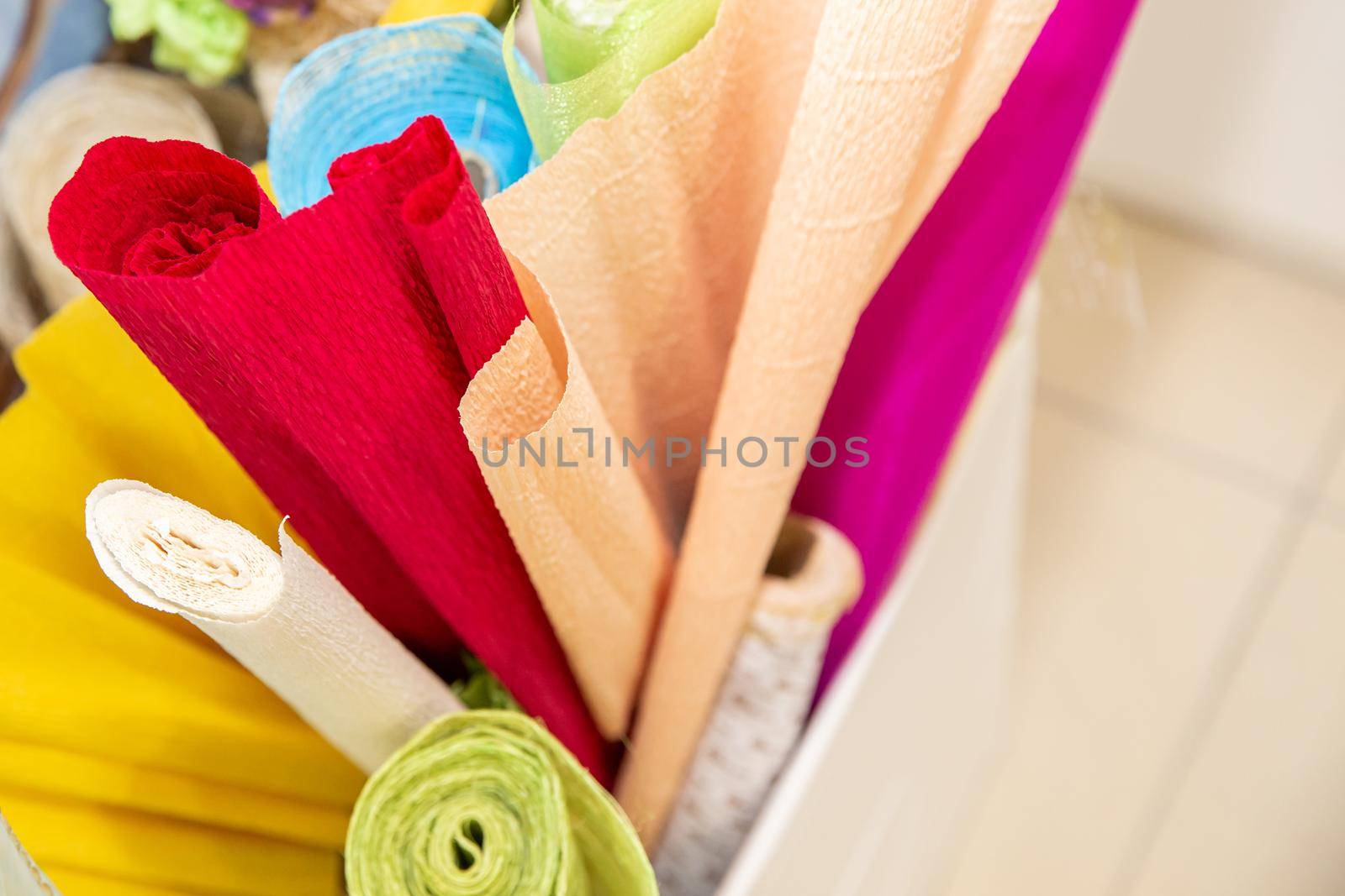 Rolls of gift wrapping paper and rolls of ribbon