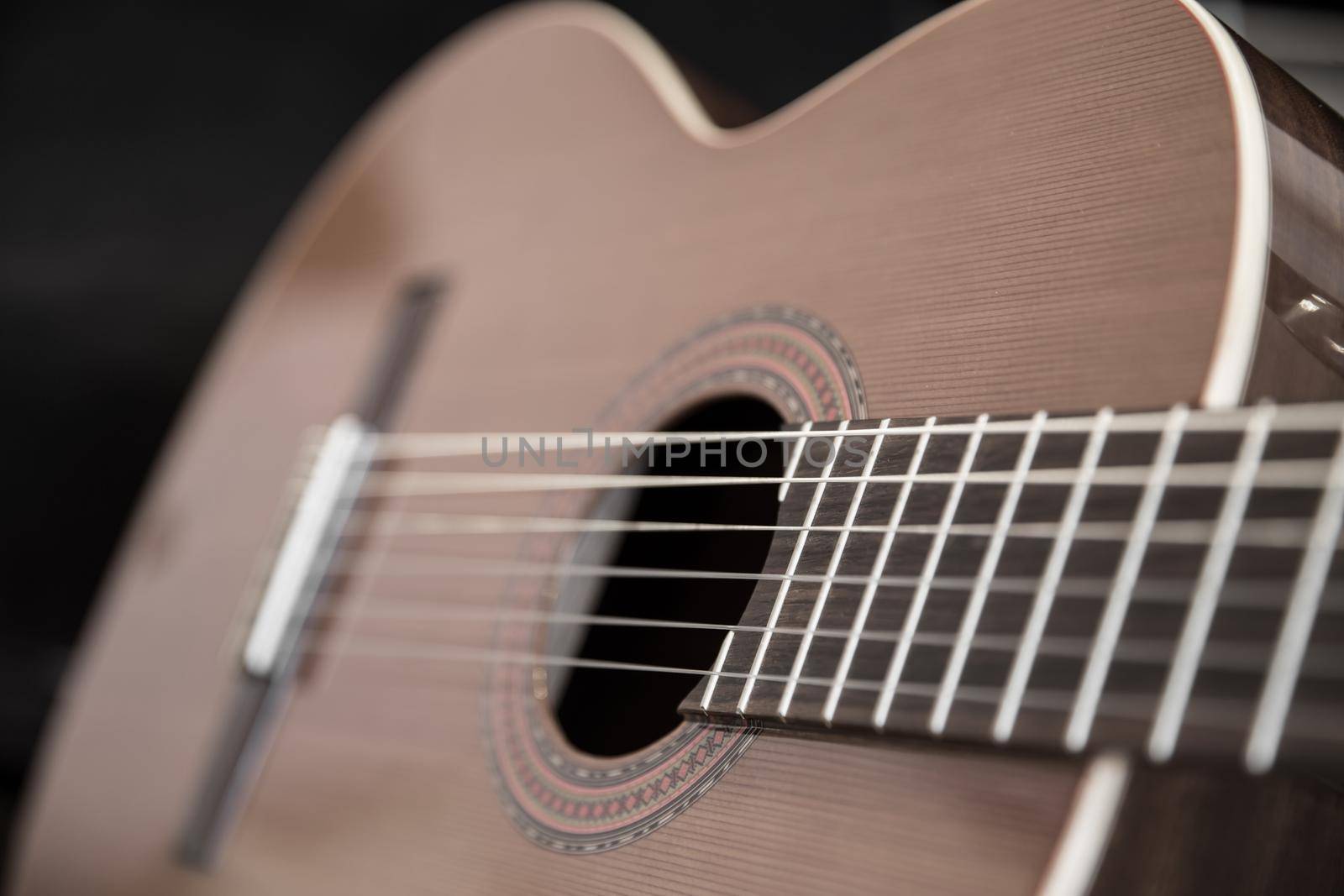 A classical guitar with six nylon strings