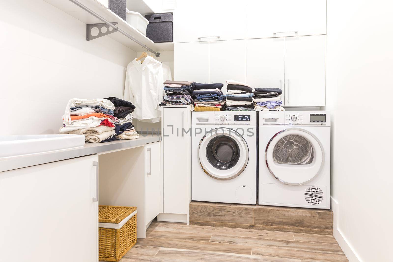 Stacks of clean clothes in utility room