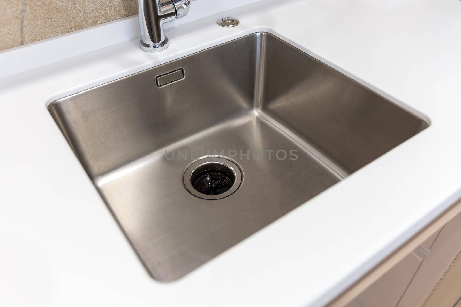 Stainless kitchen sink with food waste disposal