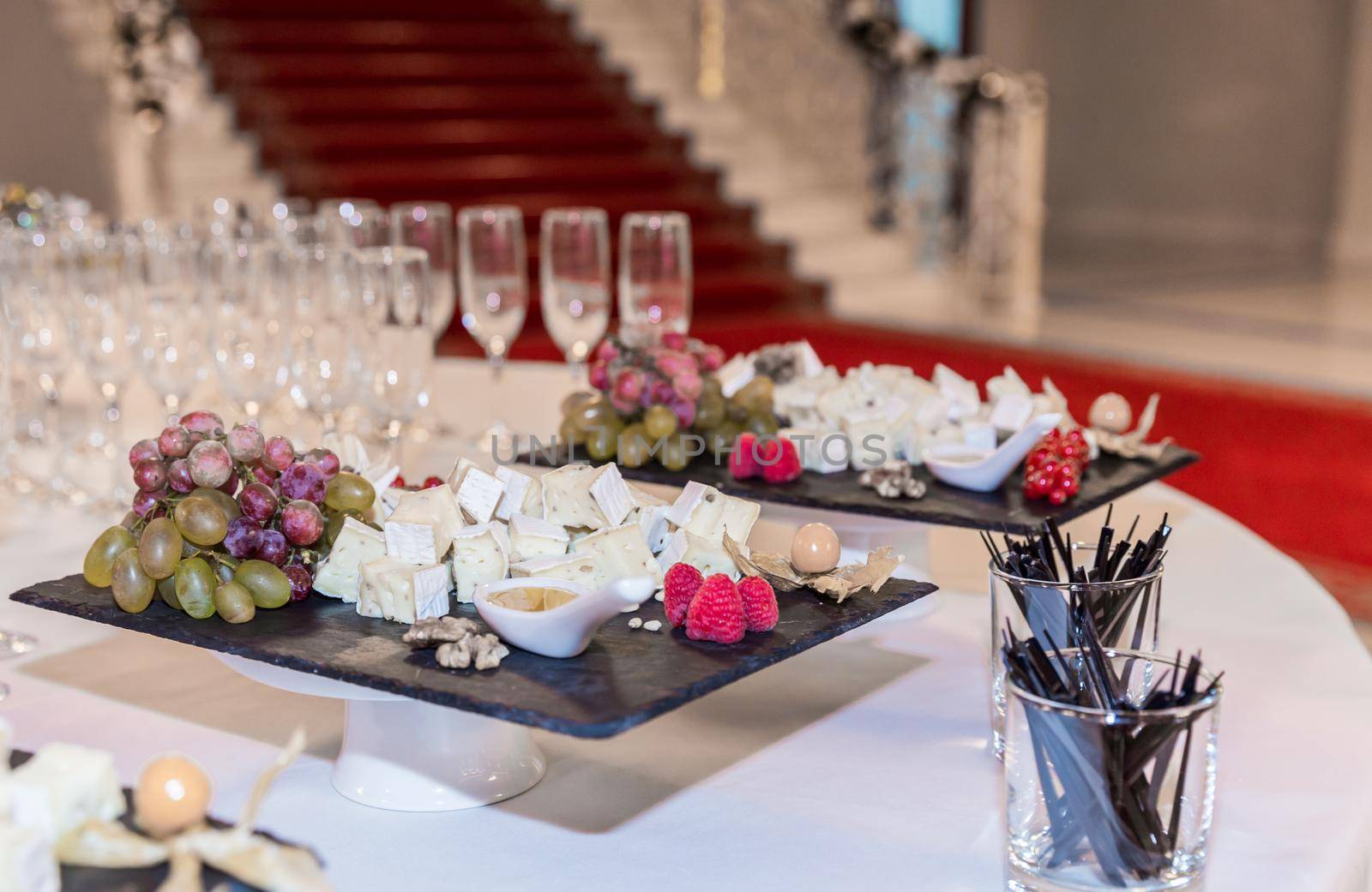 Buffet table with brie cheese and grapes