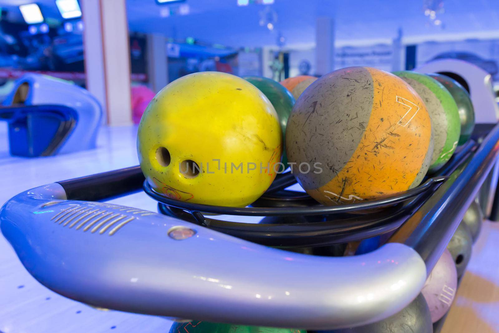a set of multi coloured balls for bowling playing