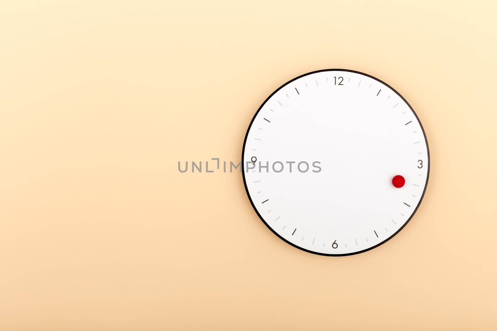 Modern white clock hanging on orange wall with copy space