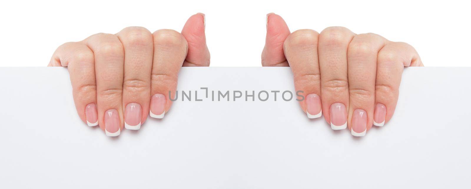Close up of female hand holding blank advertising card on white