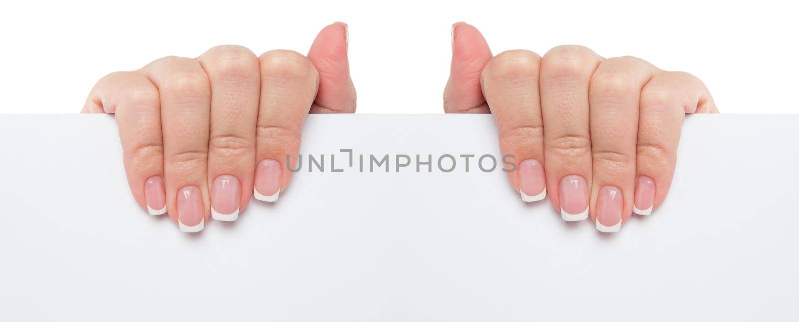 Close up of female hand holding blank advertising card on white