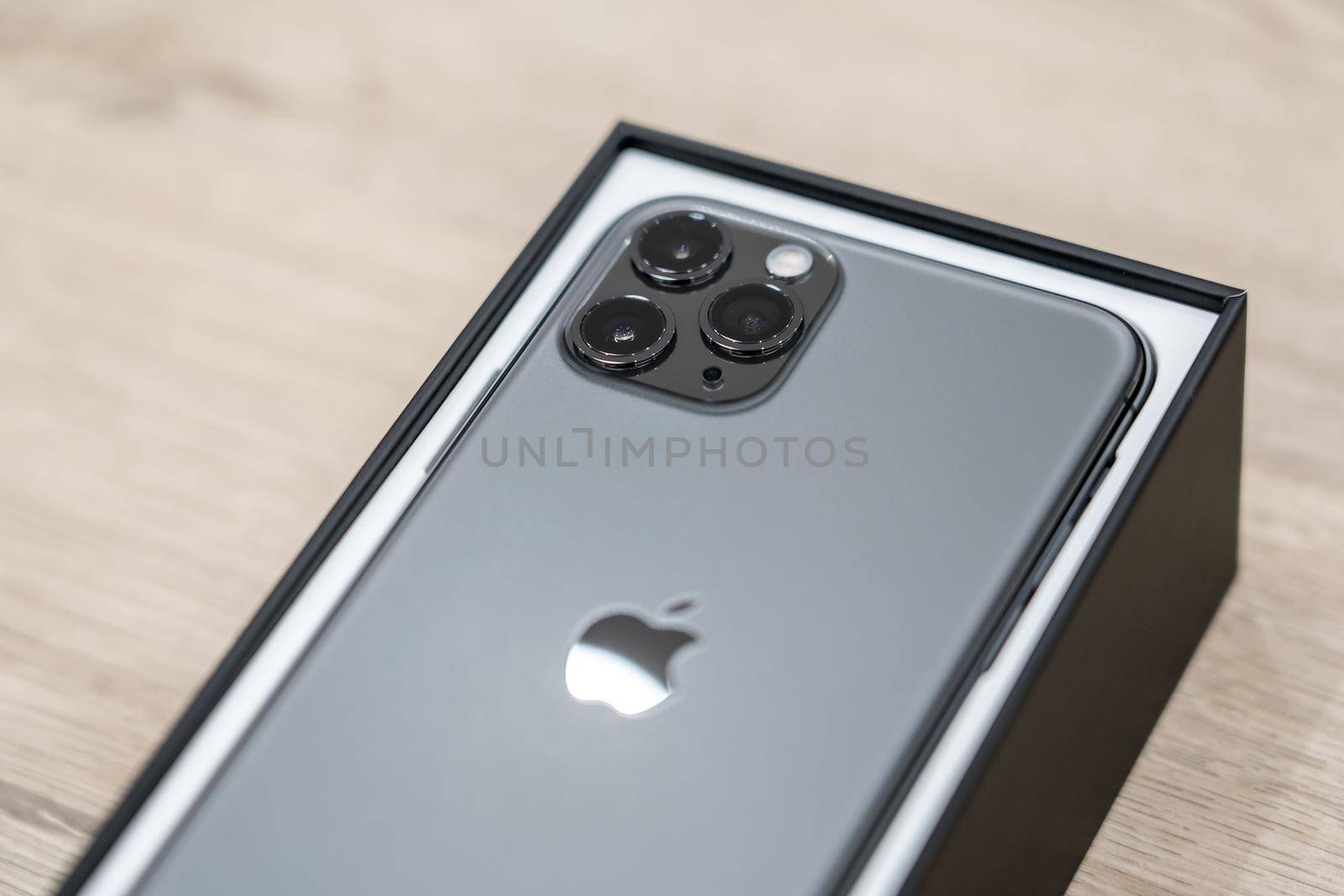 Moscow, Russia - September 24, 2019: new Apple iPhone 11 pro in box on wooden background