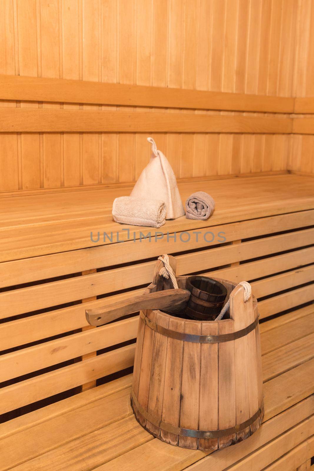 Inside view of traditional sauna with some equipment