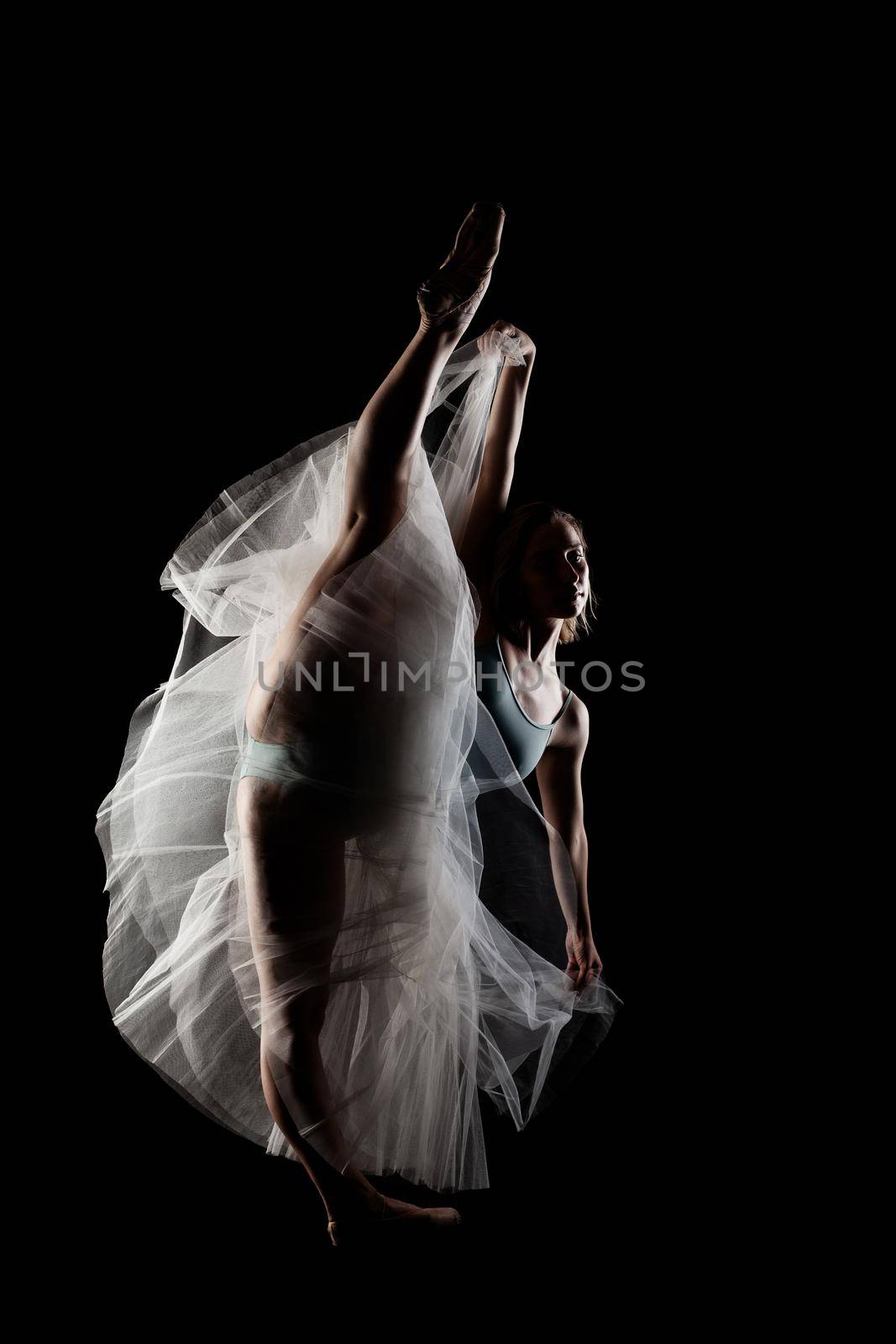 ballerina with a white dress and black top posing on black background by kokimk