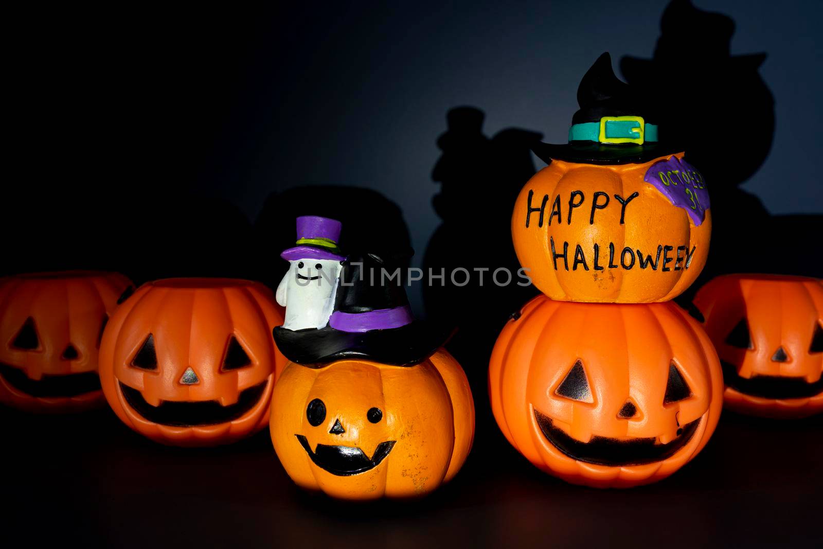 Beautiful jack o lantern pumpkin on a dark background. Halloween concept backdrop