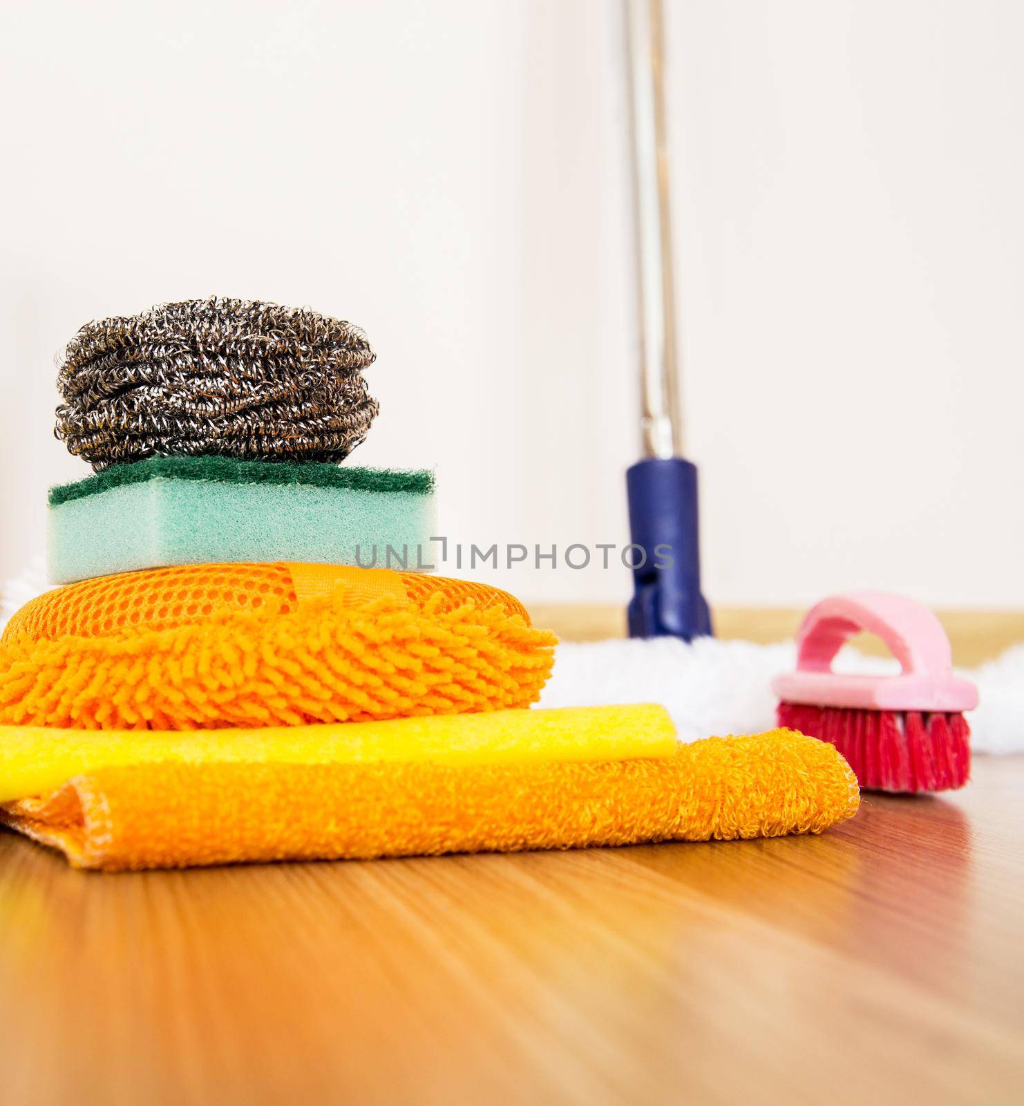 set of cleaning equipment on a wooden floor