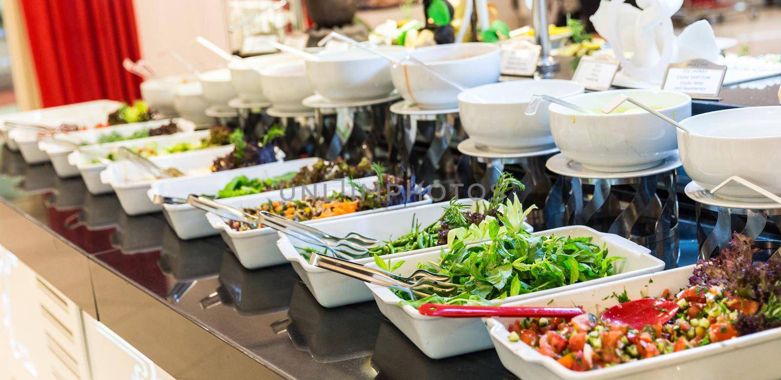 Variety of fresh salads in a buffet
