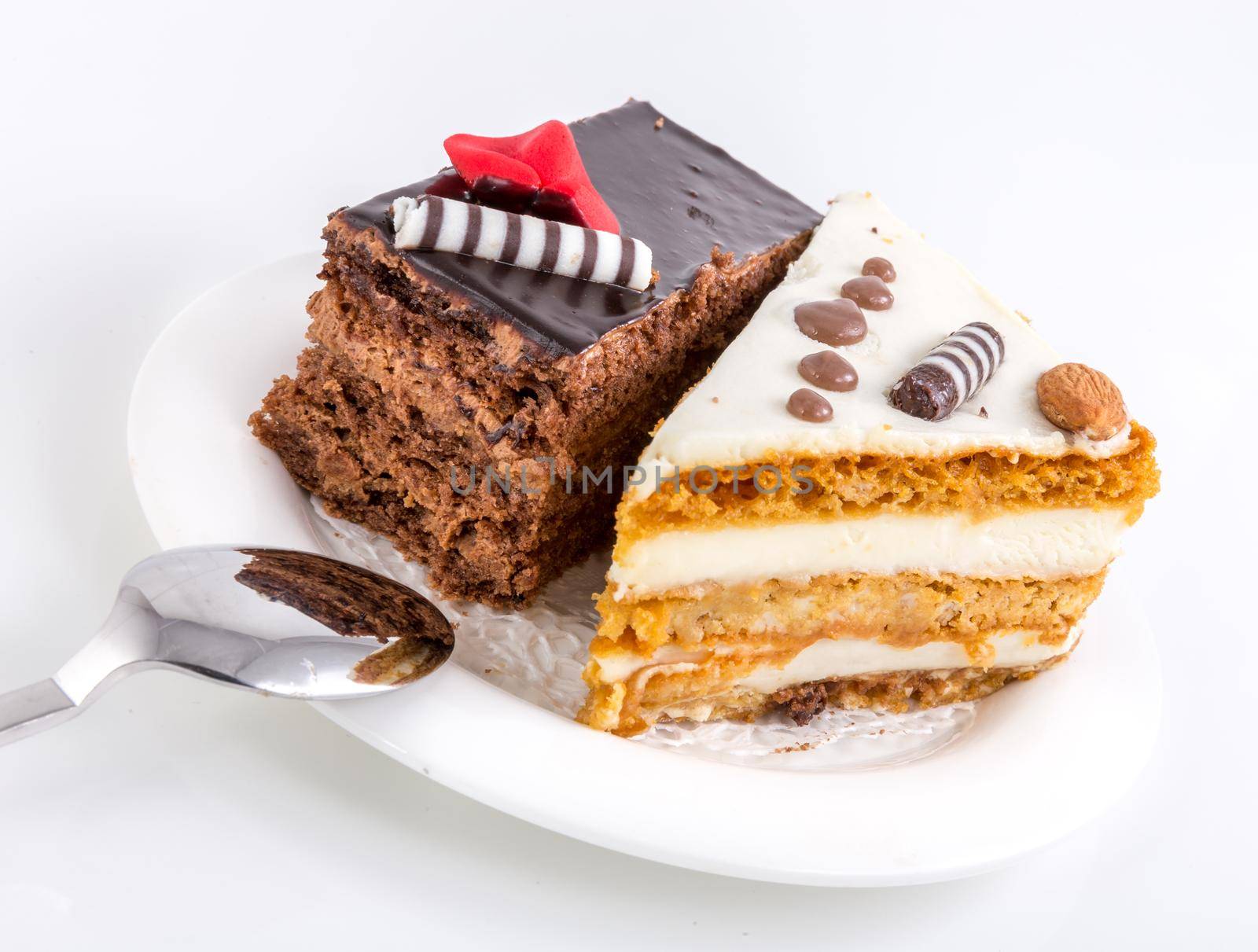 Two pieces of tasty cake on white saucer