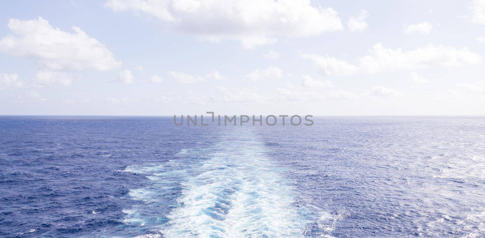 Cruise ship wake or trail on ocean surface by Mariakray
