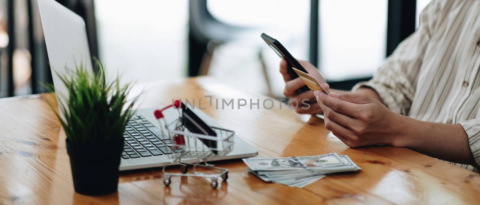 shopping online with credit card using smart phone at home. online purchase concept by nateemee