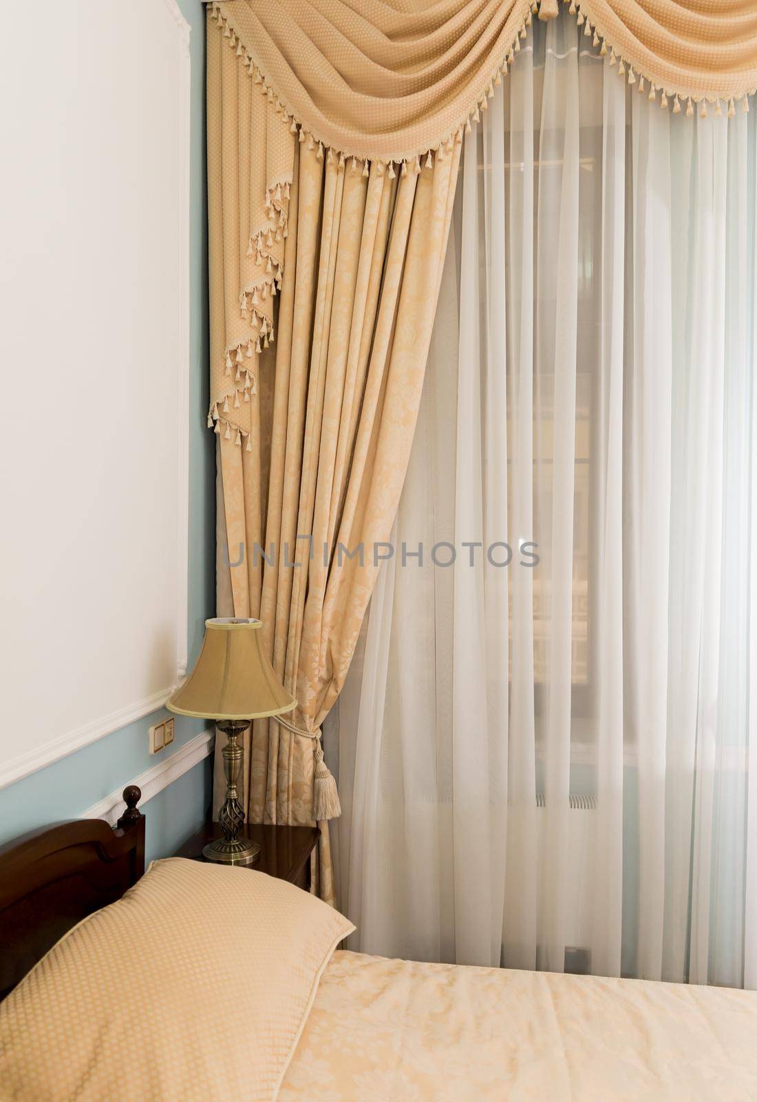 classic beige curtain hanging on a window