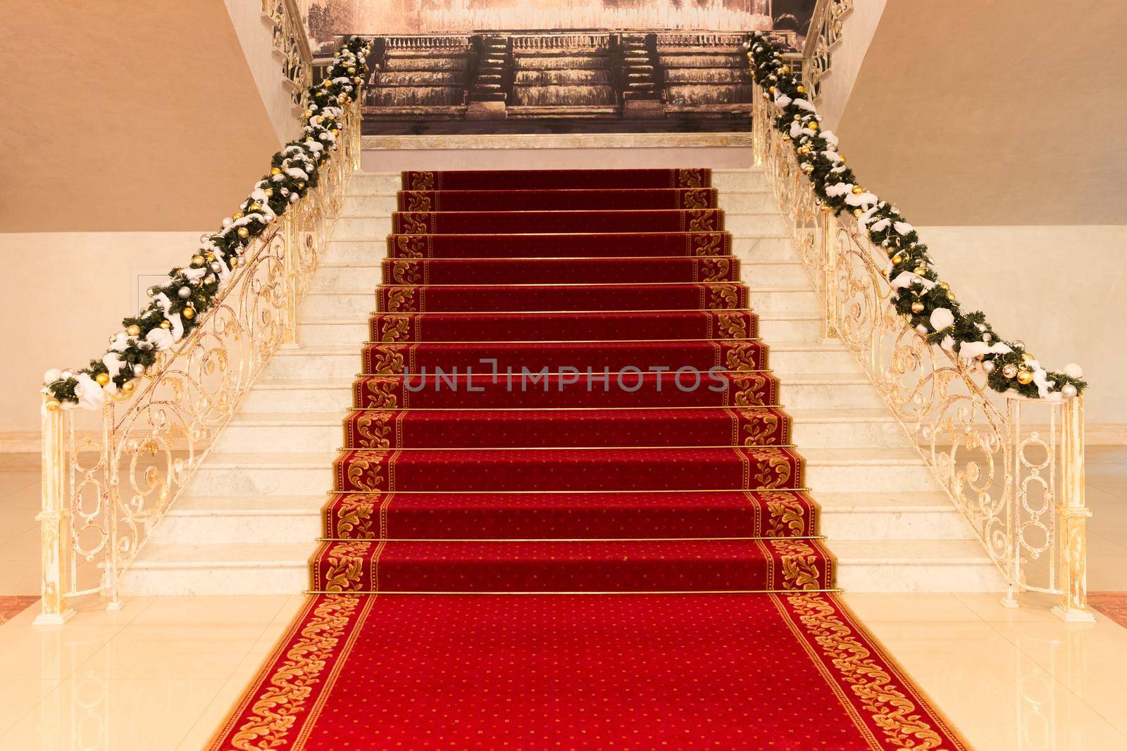 Classic red carpet on a marble staircase