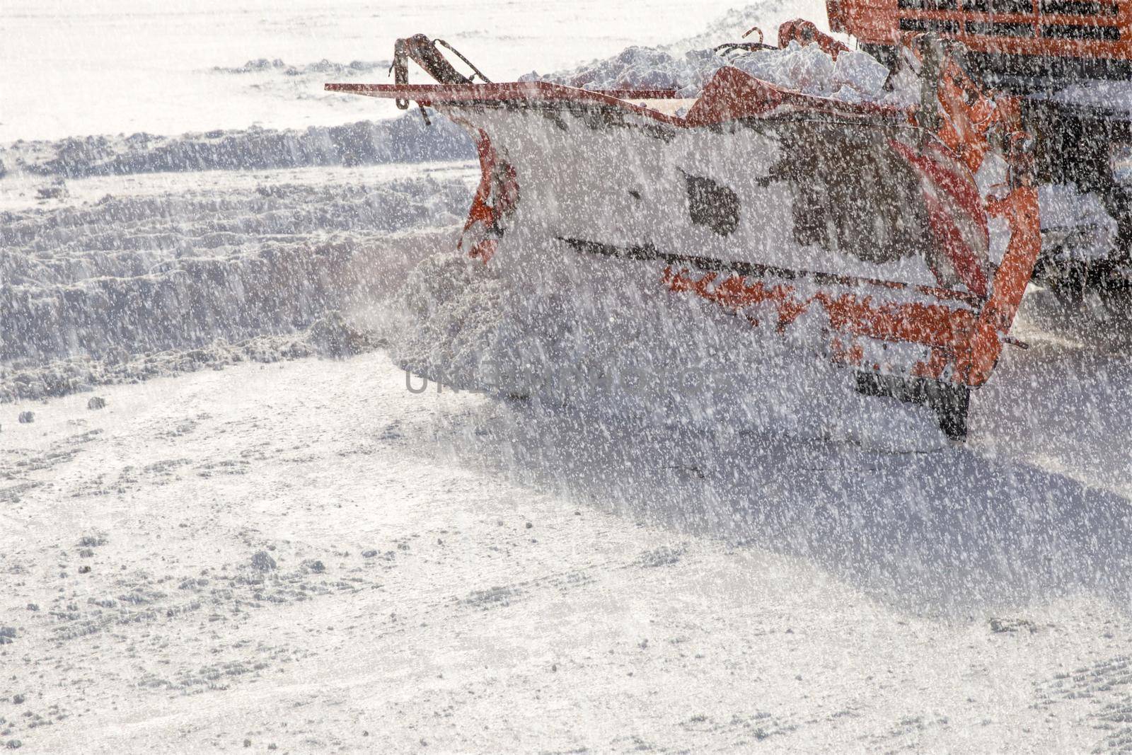 Snowplow removing snow from city road
