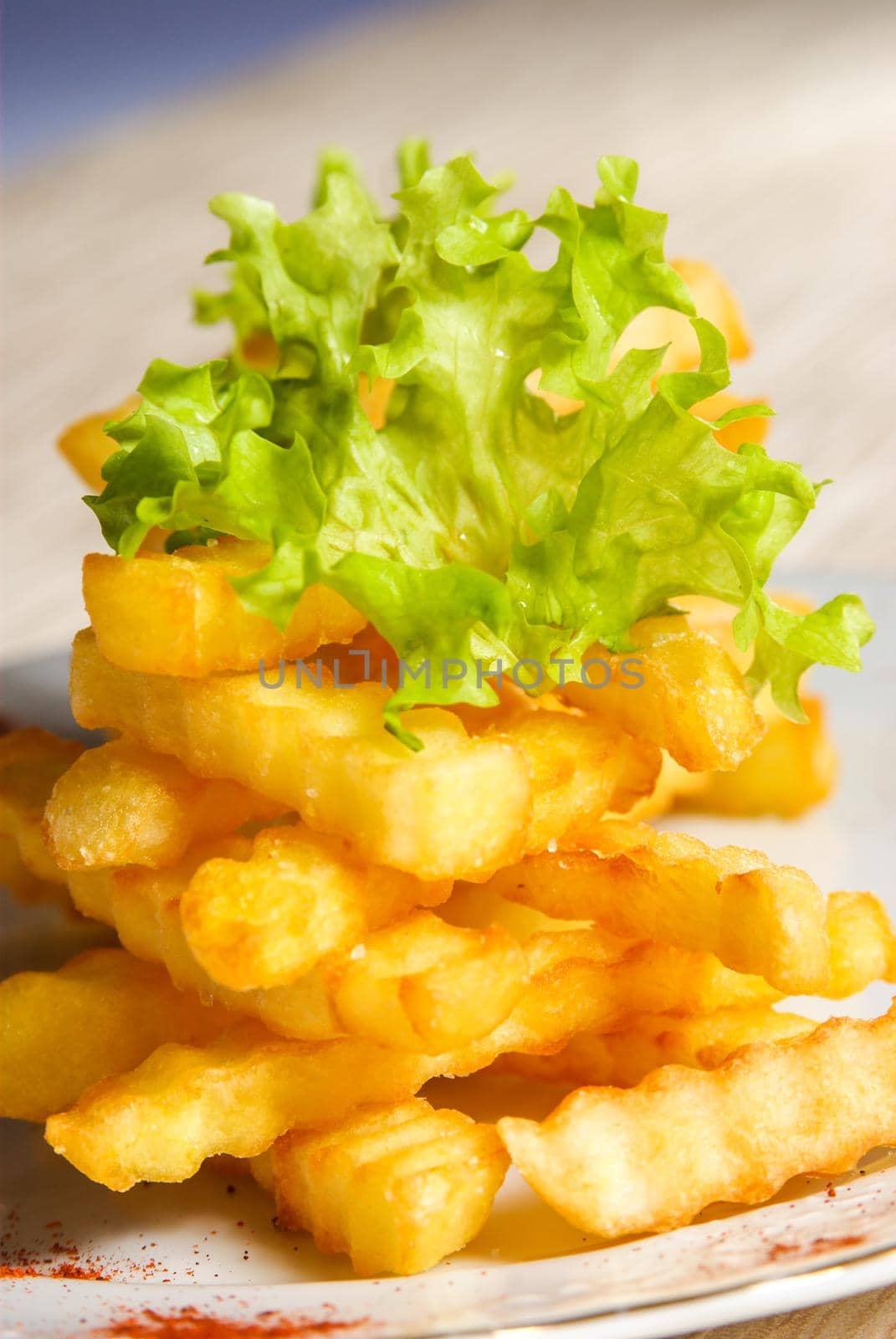 Fresh fried wavy french fries tower