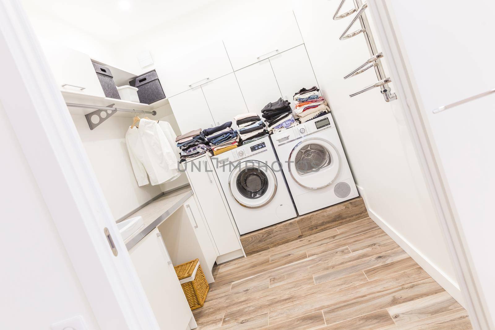 Stacks of clean clothes in utility room