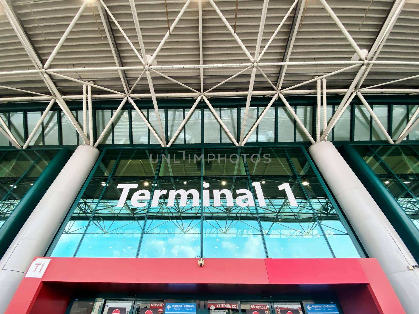 Rome, Italy, August 2021: The main entrance to Terminal 1 for departures at the Leonardo Da Vinci international airport in Fiumicino, Rome, Italy. by rarrarorro
