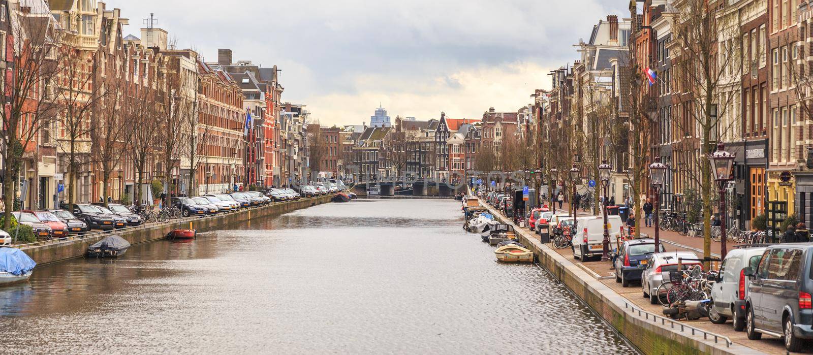 AMSTERDAM, NETHERLANDS - MARCH 15: Streets of the city with canals, on March 15, 2014 in Amsterdam