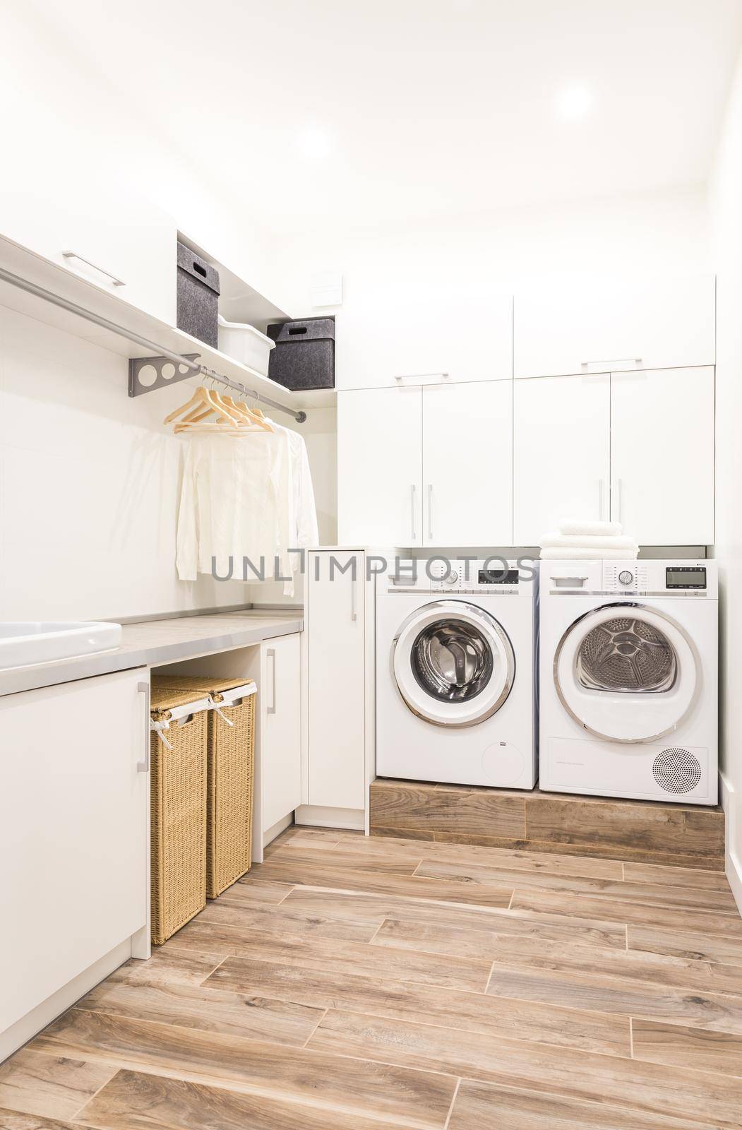 Laundry room with washing machine in modern home