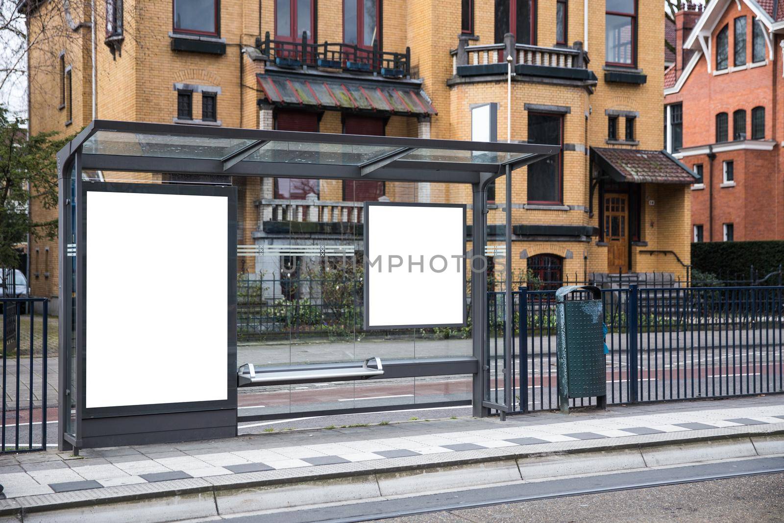 Blank billboard on a roadside in european town