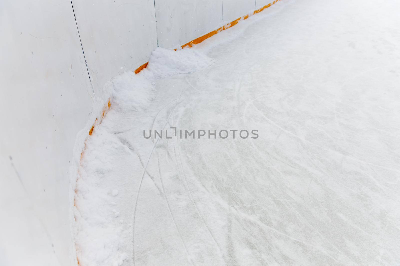 Ice background with marks from skating and hockey. blue texture