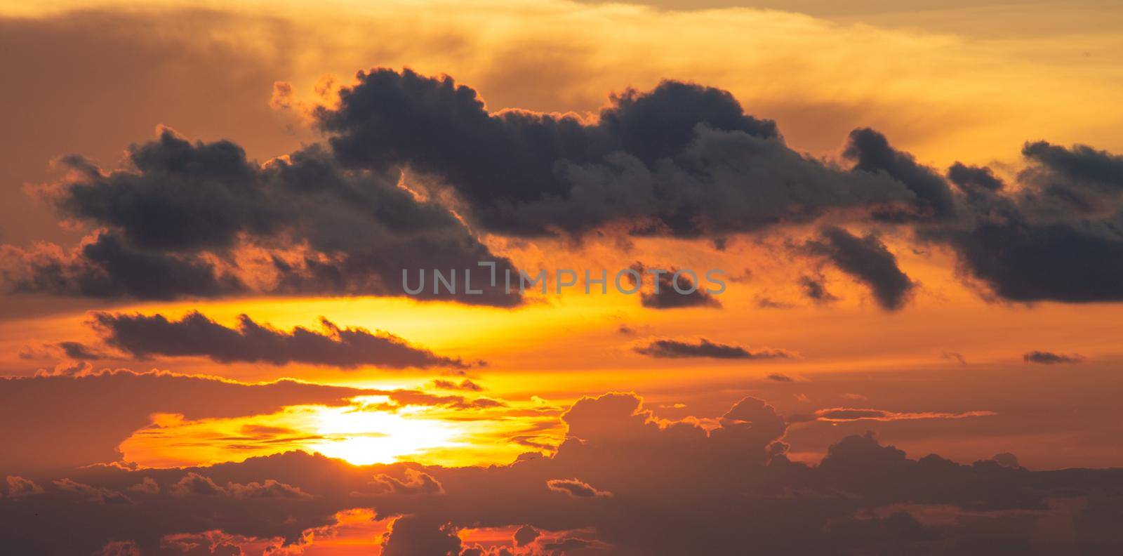 Dramatics orange and red sunset or sunrise sky with clouds for background by Mariakray