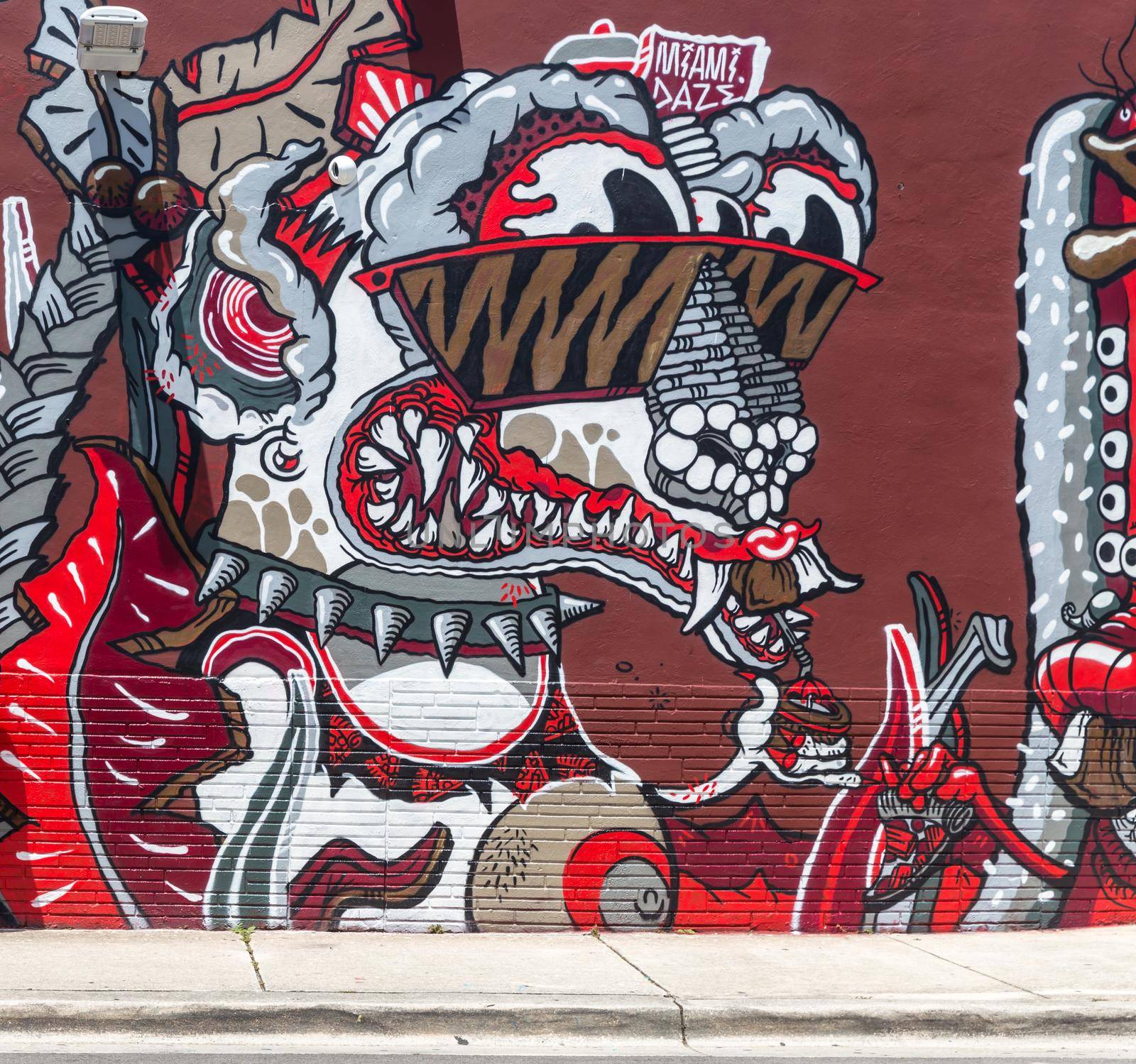 Street art graffiti. Abstract creative drawing on the walls of Miami city. USA urban Contemporary Culture