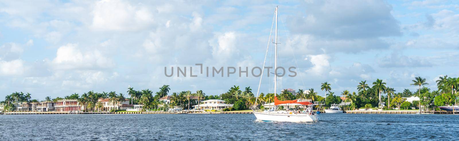 FORT LAUDERDALE, FLORIDA - September 20, 2019: Panorama of mansions in Fort Lauderdale from the canal by Mariakray
