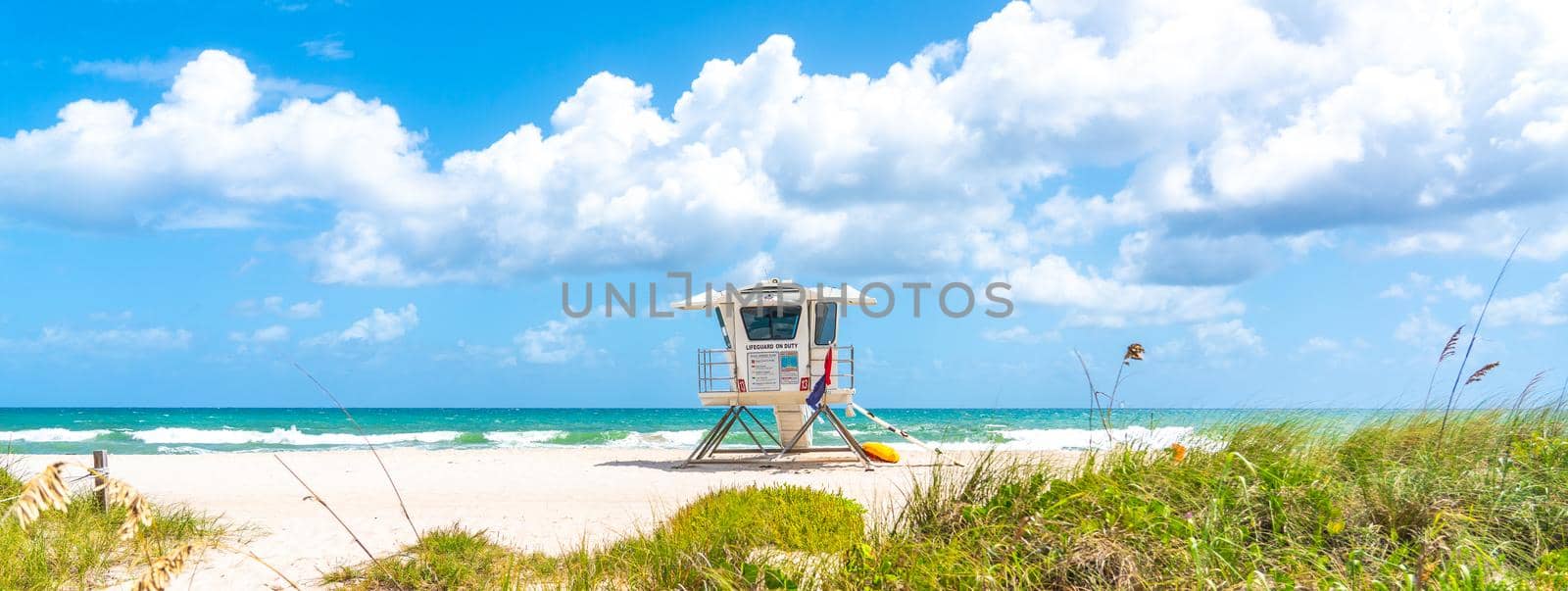 Fort Lauderdale, Florida, USA - September 20, 2019: Seafront beach promenade with palm trees
