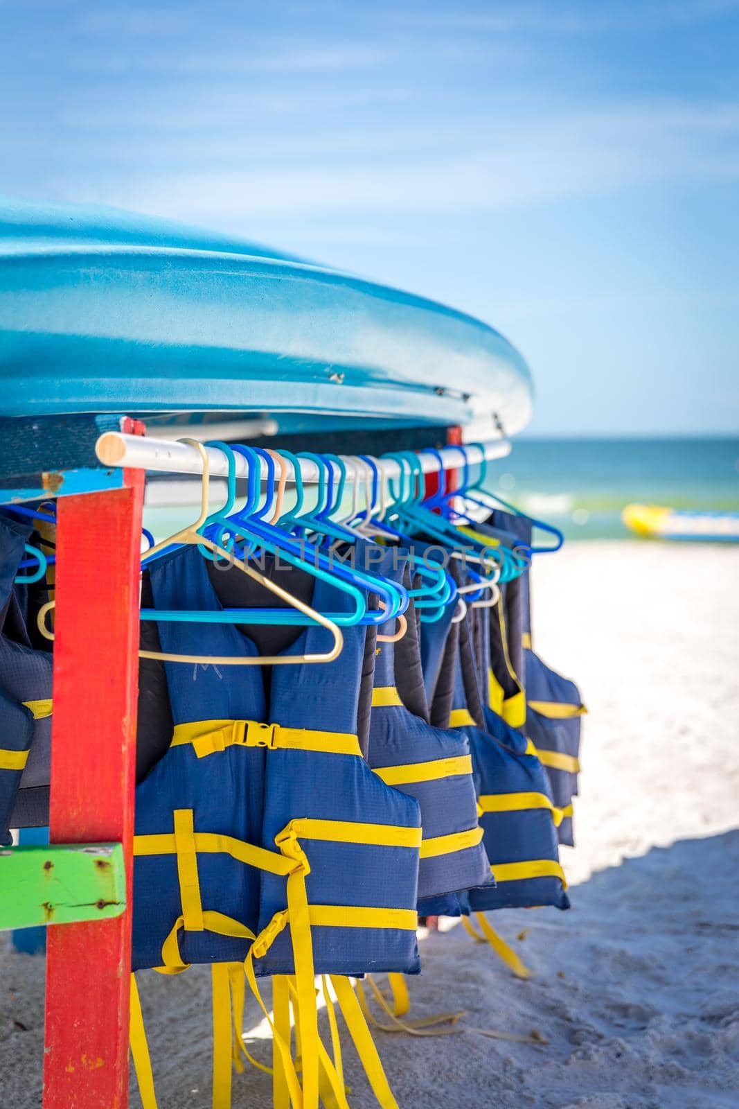 ST.PETE BEACH, FLORIDA, USA - SEPTEMBER 03, 2014: Life jackets and boats on St.Pete beach in Florida, on September, 2014, USA.