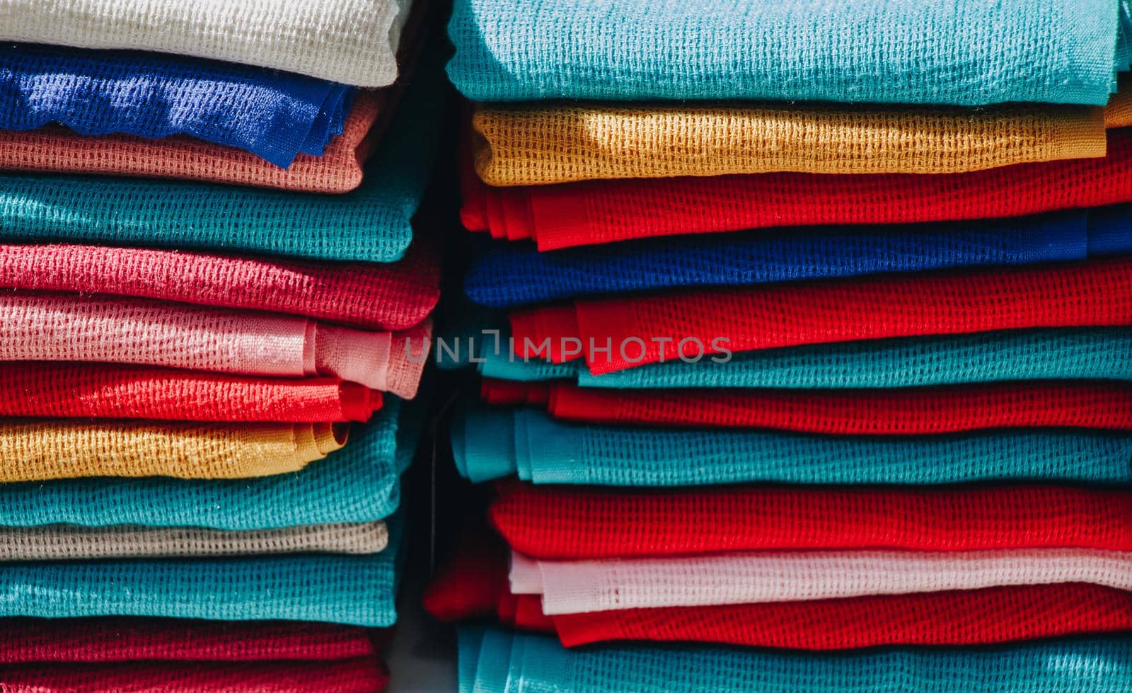 Pile of bright Multi-colored pieces of fabric in a bazaar