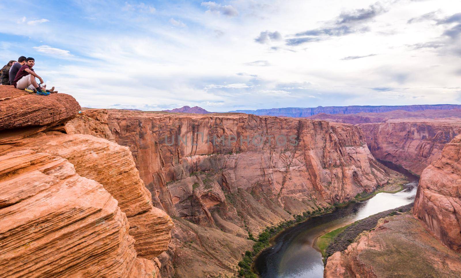 PAGE, ARIZONA - MAY 25: Hikers at Horseshoe Bend on May 25, 2015 in Page AZ,USA. Thousands of people from all over the world visit this unique place every year.