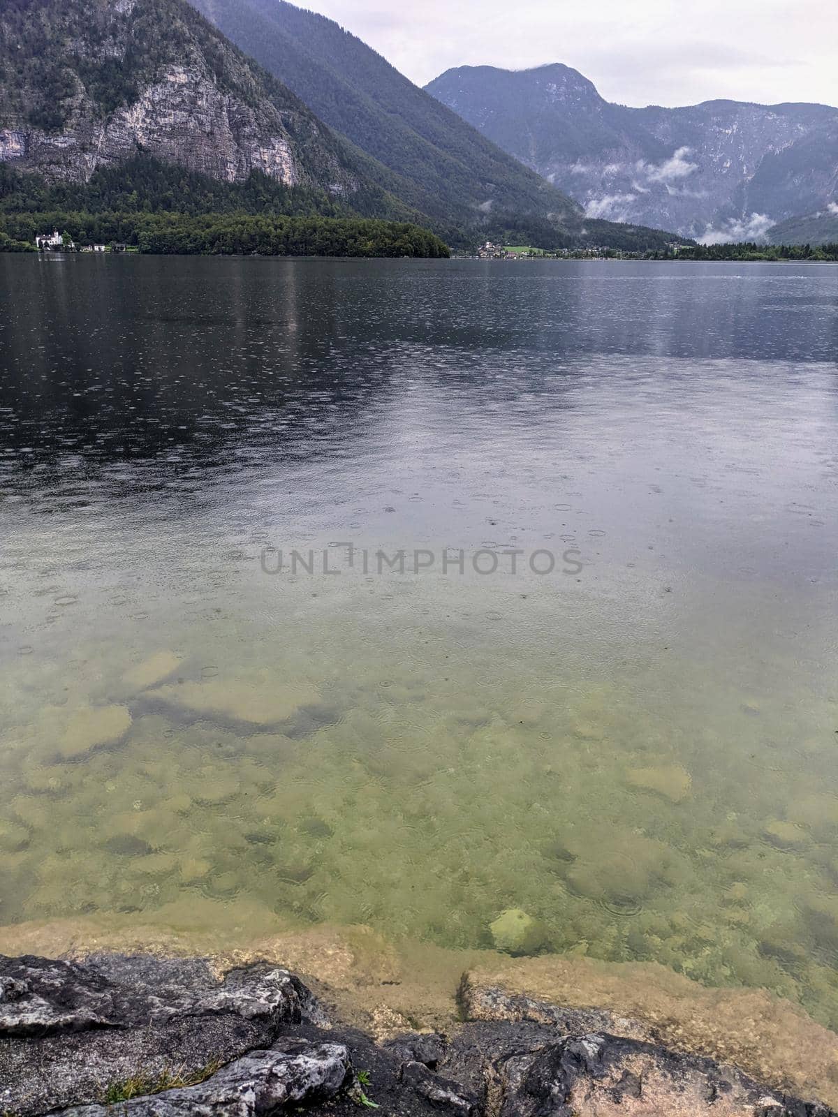Alpine lake Hallstatter See during rain calming scene by weruskak