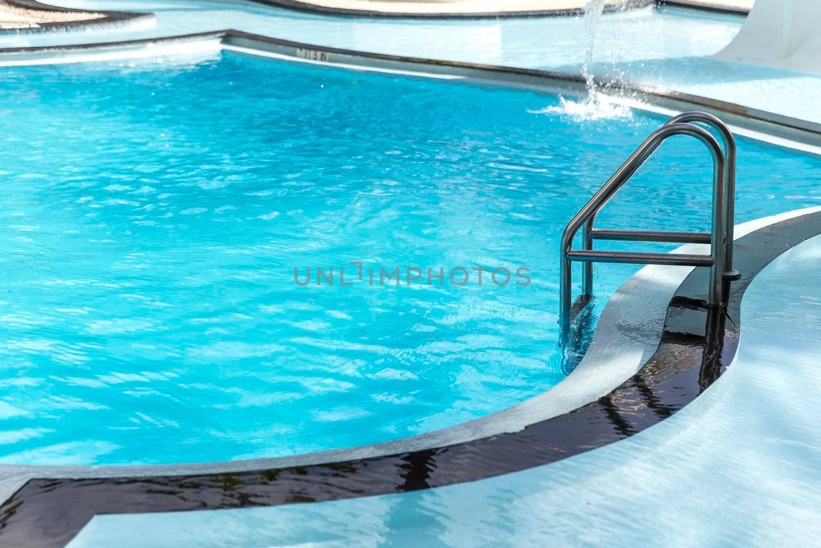 Metal ladder leading into the swimming pool