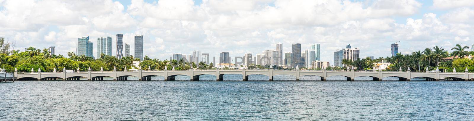 Miami skyline with skyscrapers and bridge over the sea