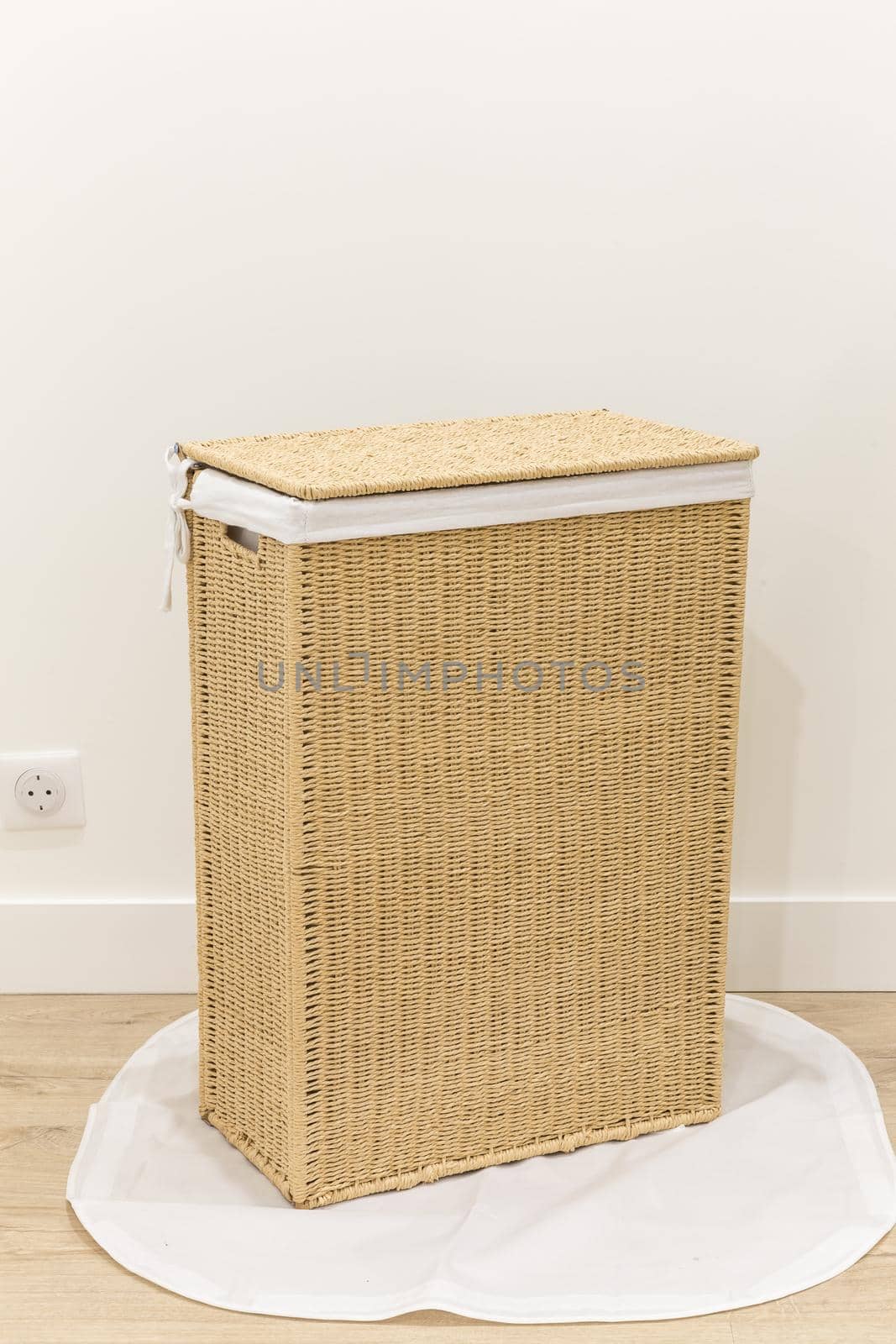 Isolated on white laundry basket made of rattan