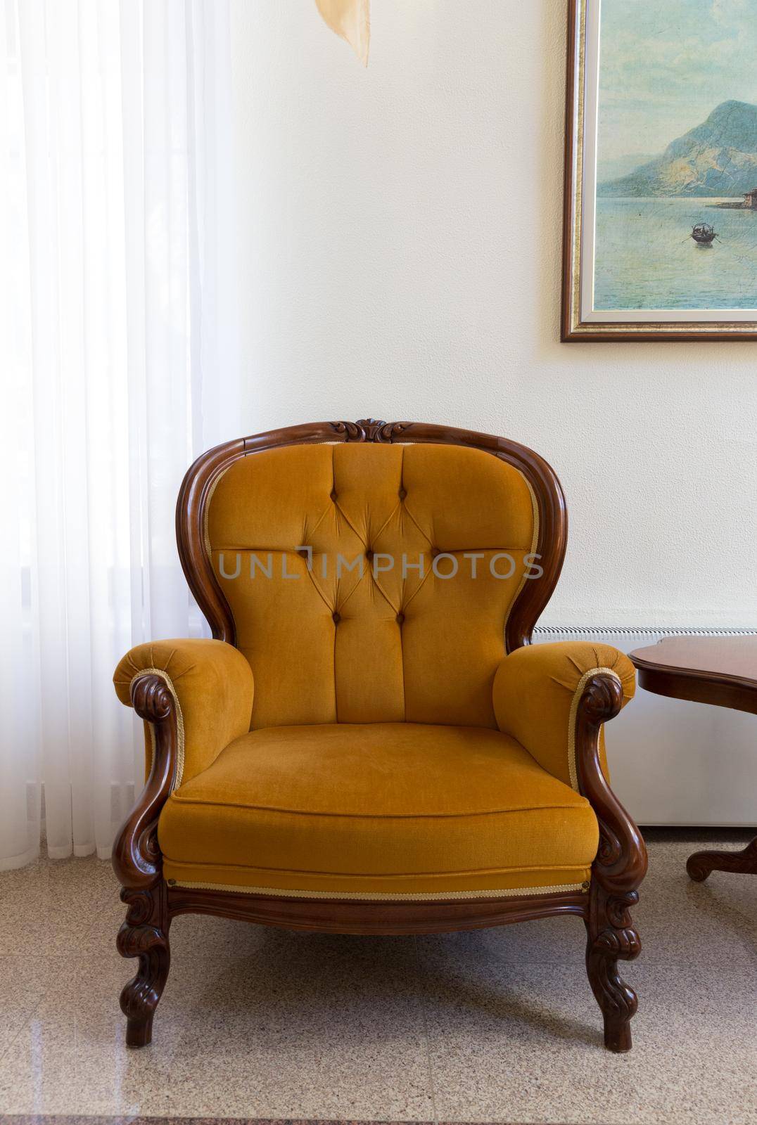 Antique orange armchair isolated on white background