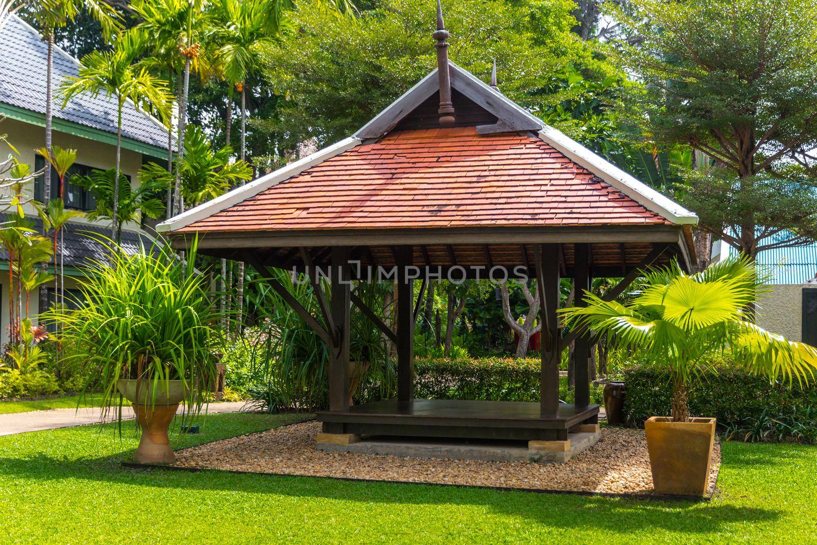 beautiful wooden gazebo in tropical nature in Thailand by Mariakray